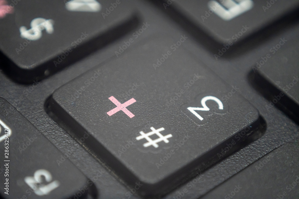 Close up of the number 3 and pound key on a keyboard Close up of the number 3 and pound key on a keyboard