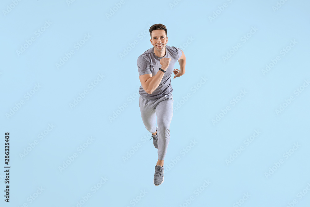 Running young man on color background Running young man on color background
