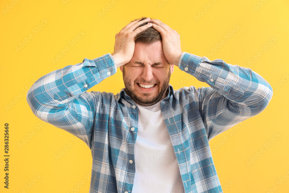 Man having panic attack on color background Man having panic attack on color background