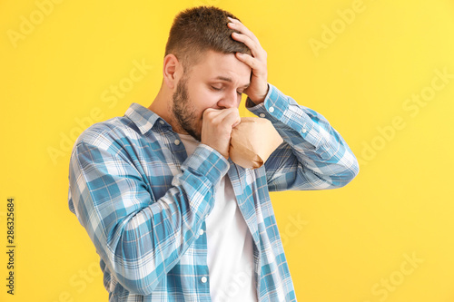 Man with paper bag having p...