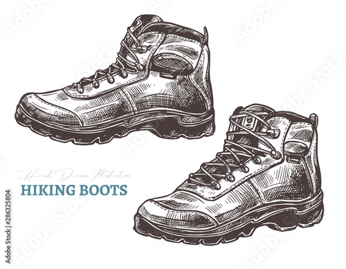 Hand drawn hiking boots. Isolated vector illustration in sketch engraving style