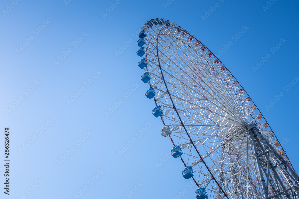 Osaka ferris wheel with beautiful blue sky