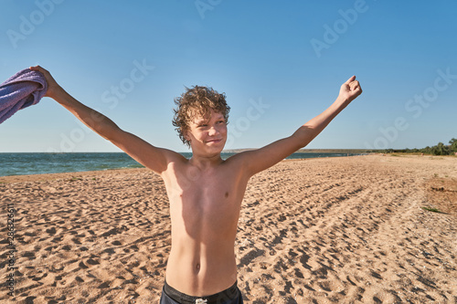Teenager enjoing summer on a seashore. © Nicole's