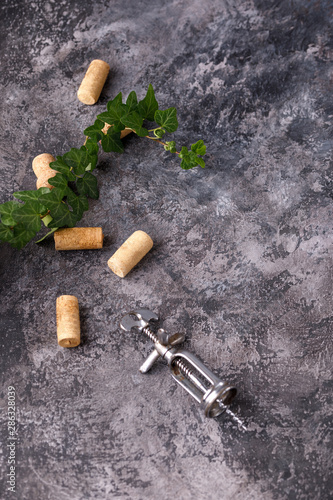 Exquisite vintage corkscrew for wine on a textural background. Copy space. Place for your text.
