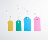 colored paper tags on a white rope, white background