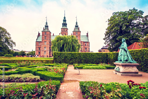Obraz na płótnie Breathtaking magical landscape with statue of Queen Caroline Amalie in the park of famous Rosenborg Castle in Copenhagen, Denmark. Exotic amazing places. Popular tourist atraction. w salonie