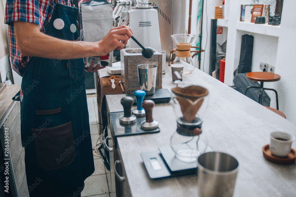 Professional barista preparing coffee alternative method Professional barista preparing coffee alternative method