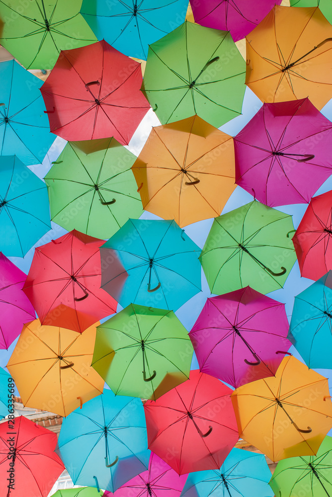 Colorful umbrellas on the street in Agueda, Aveiro - Portugal Colorful umbrellas on the street in Agueda, Aveiro - Portugal