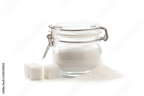 Fotografie glass can with clasp full of sugar isolated  on white