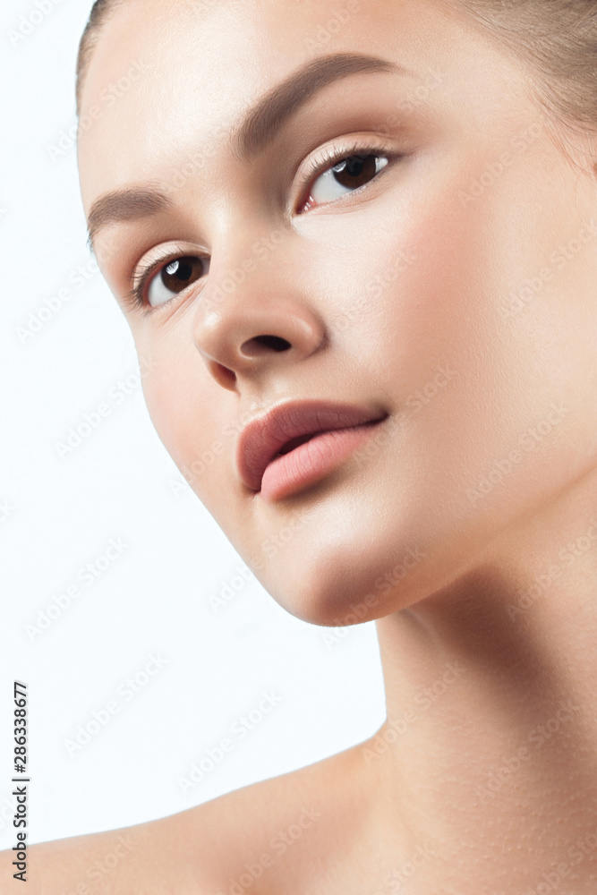 Young beautiful woman with clean perfect skin close-up Young beautiful woman with clean perfect skin close-up