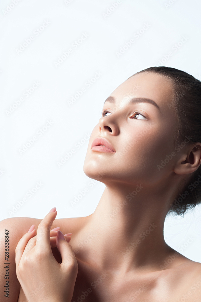 Naklejka premium Young beautiful woman with clean perfect skin close-up