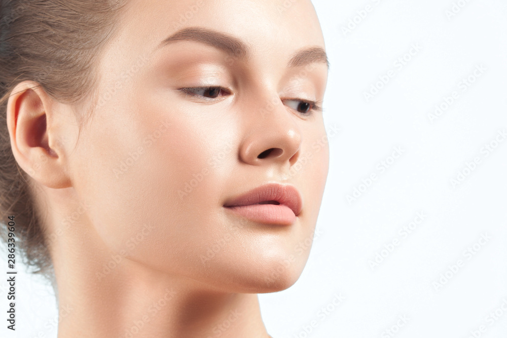 Young beautiful woman with clean perfect skin close-up