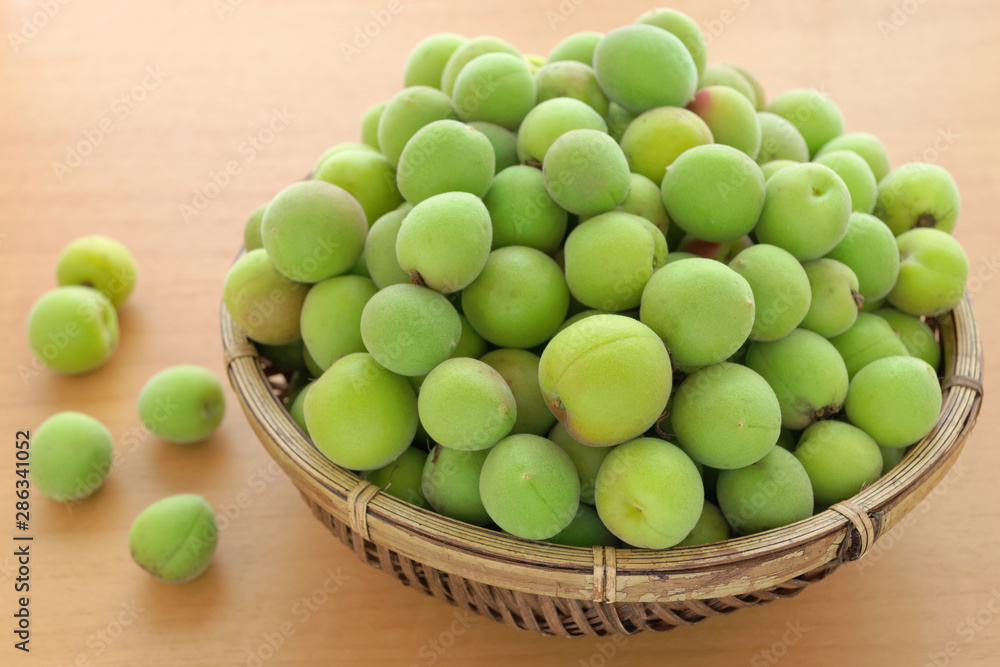 Japanese apricot(ume) fruits in bamboo basket Japanese apricot(ume) fruits in bamboo basket