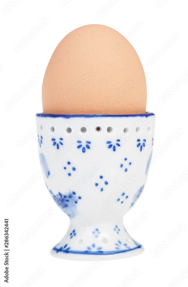 brown boiled egg in cup with a pointy end up brown boiled egg in cup with a pointy end up