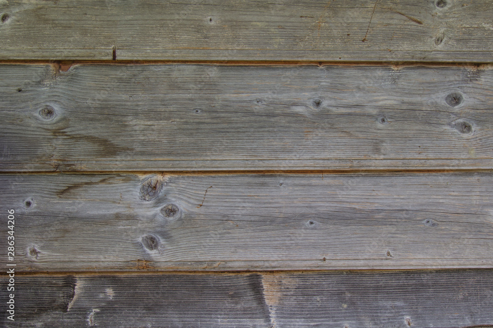 Wall of flat boards, natural background, close-up Wall of flat boards, natural background, close-up