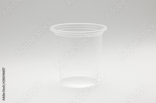 plastic water glass on pale white background