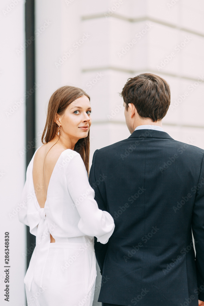 love story in the European style. happy couple on the background of the evening city. love story in the European style. happy couple on the background of the evening city.