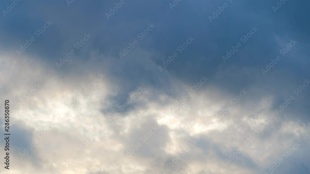 The blue sky has a beautiful white cloud mass with a copy of space, the clouds float across the sky in a period of time The blue sky has a beautiful white cloud mass with a copy of space, the clouds float across the sky in a period of time