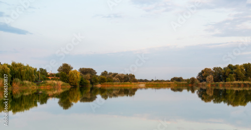 Fototapeta Naklejka Na Ścianę i Meble -  lake and blue sky and forest. beautiful landscape