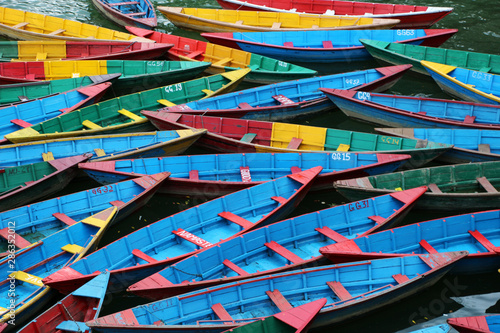 Colorful boats in Nepal on a lake