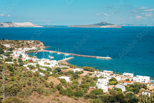 Coastal town in Greece with harbor, view to Aegean Sea, marina with sail boats, Pali, Nisyros Island, Greece