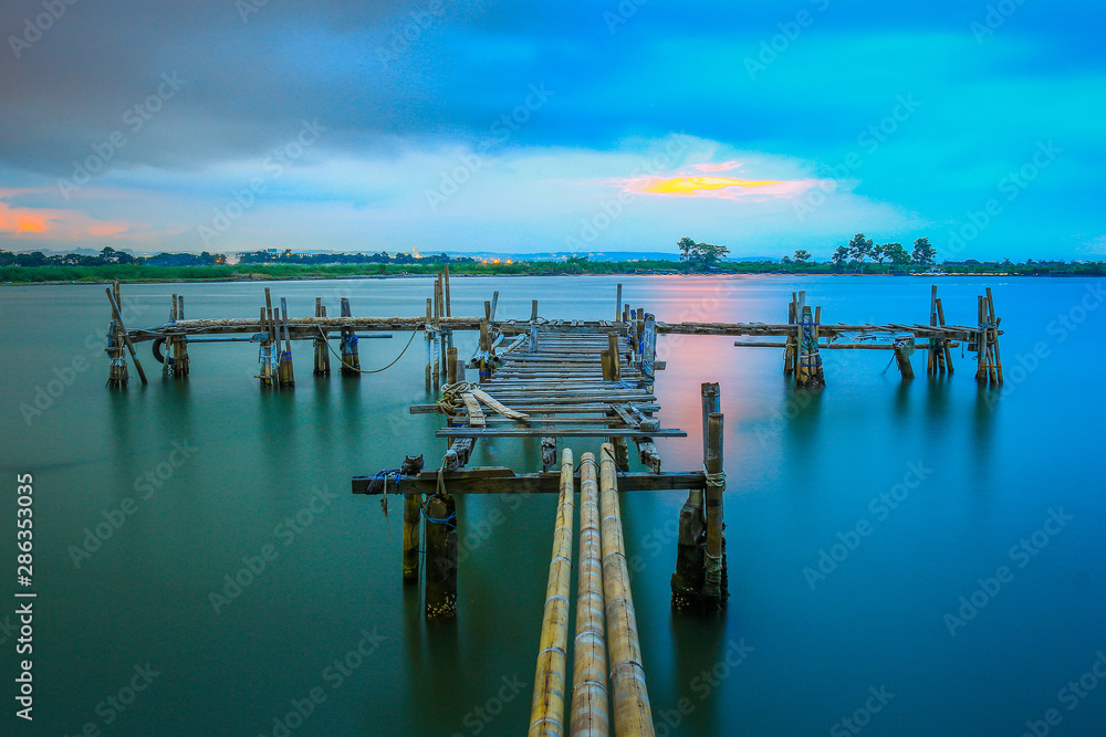 Old pier / old dock on the Marina beach at sunset