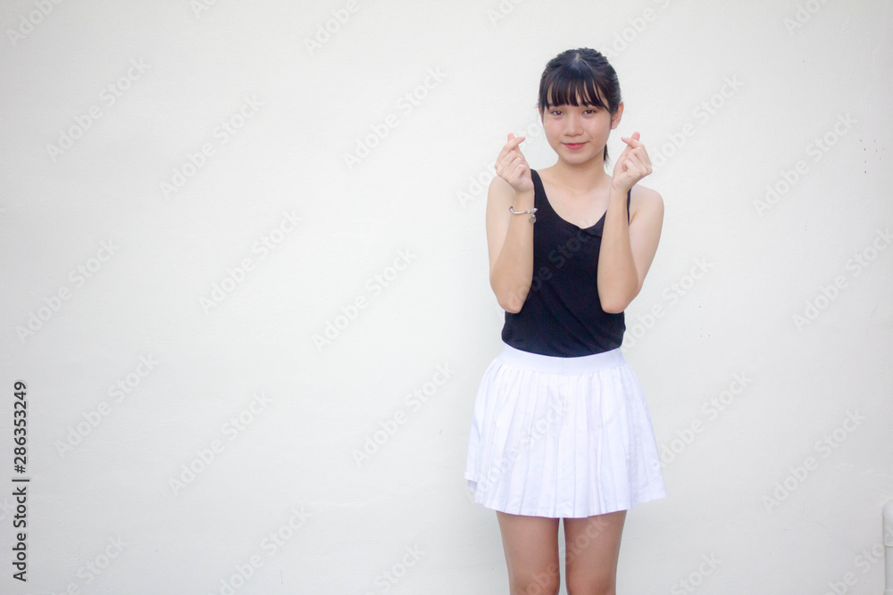 Portrait of thai adult student university uniform beautiful girl give heart Portrait of thai adult student university uniform beautiful girl give heart
