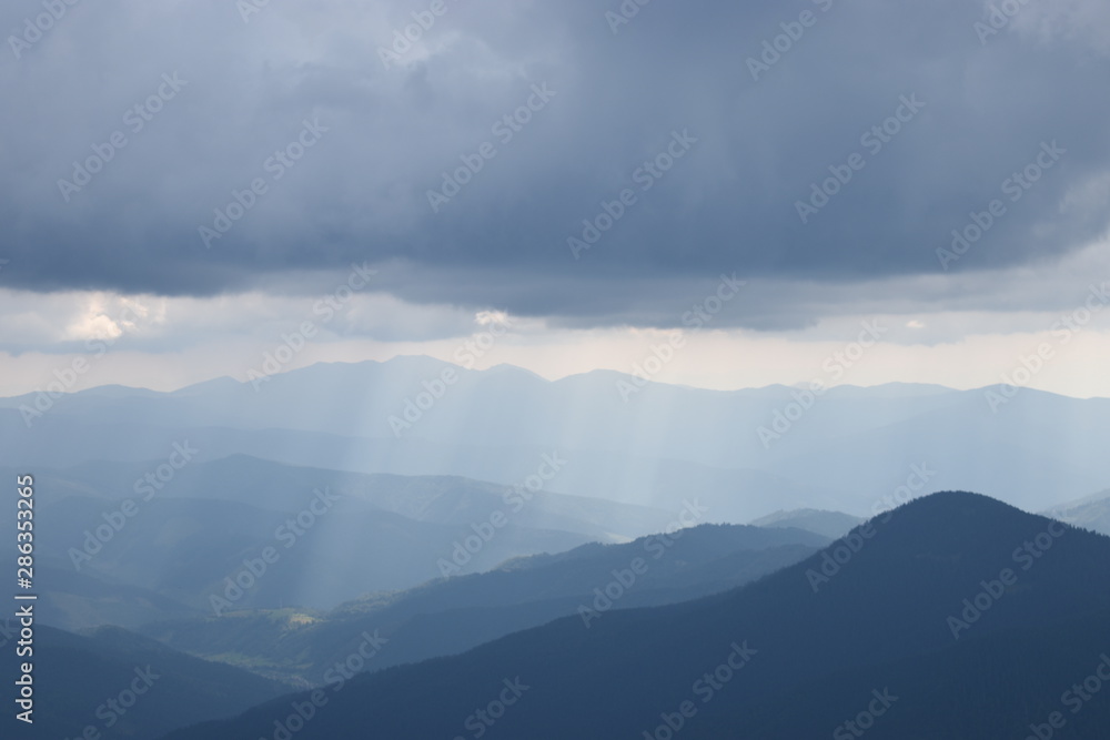 View while climbing Mount Hoverla. View of the mountain, forests and clouds. Ukrainian Carpathians. View while climbing Mount Hoverla. View of the mountain, forests and clouds. Ukrainian Carpathians.