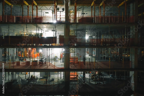 Aerial view of the high rise construction site at night