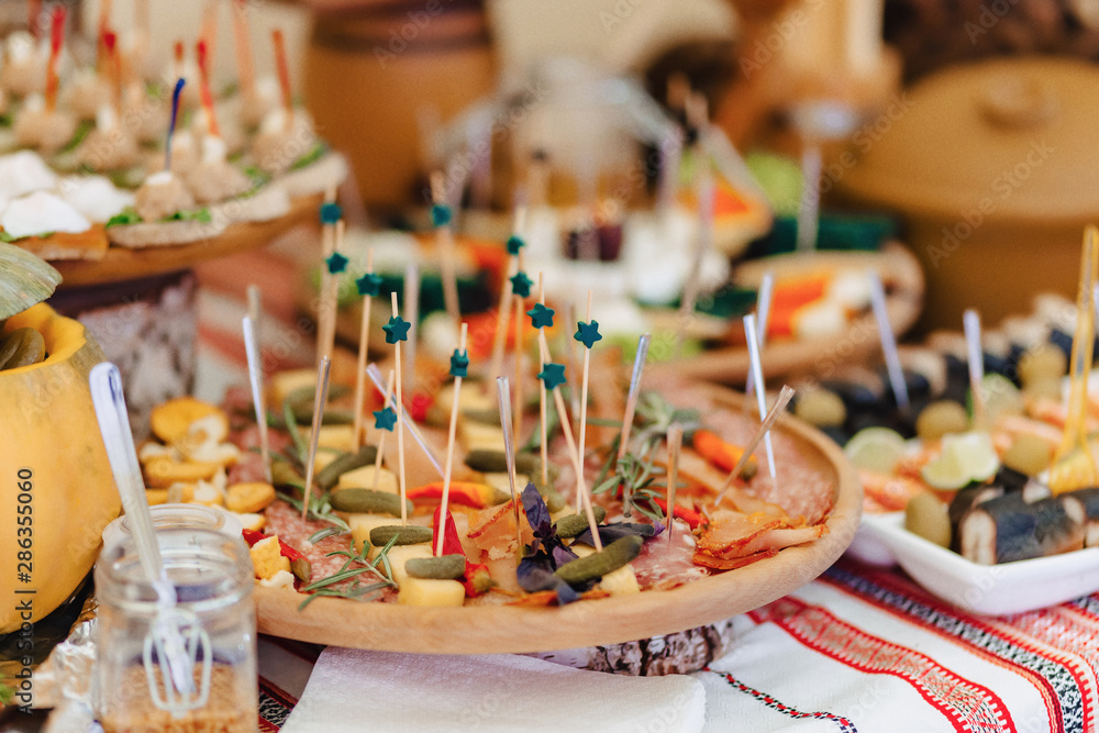 festive salty buffet, fish, meat, chips, cheese balls and other specialties for celebrating weddings and other events