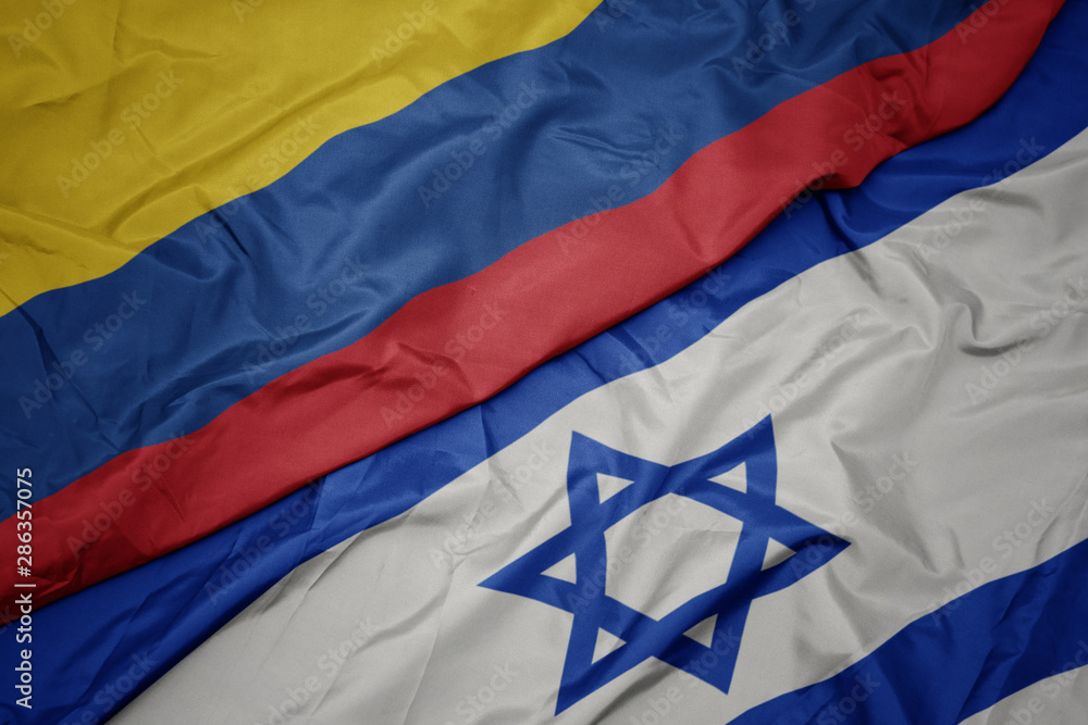 waving colorful flag of israel and national flag of colombia. waving colorful flag of israel and national flag of colombia.