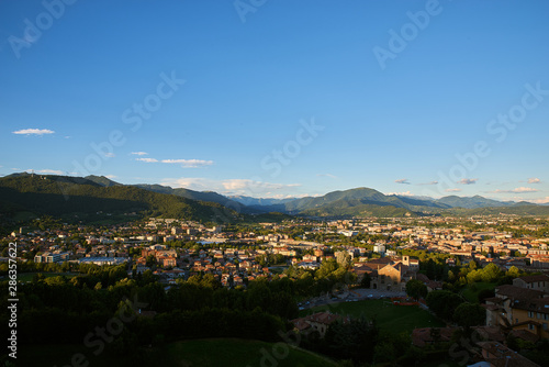Bergamo with Alps mountains and blue cloudy sky © EverGrump