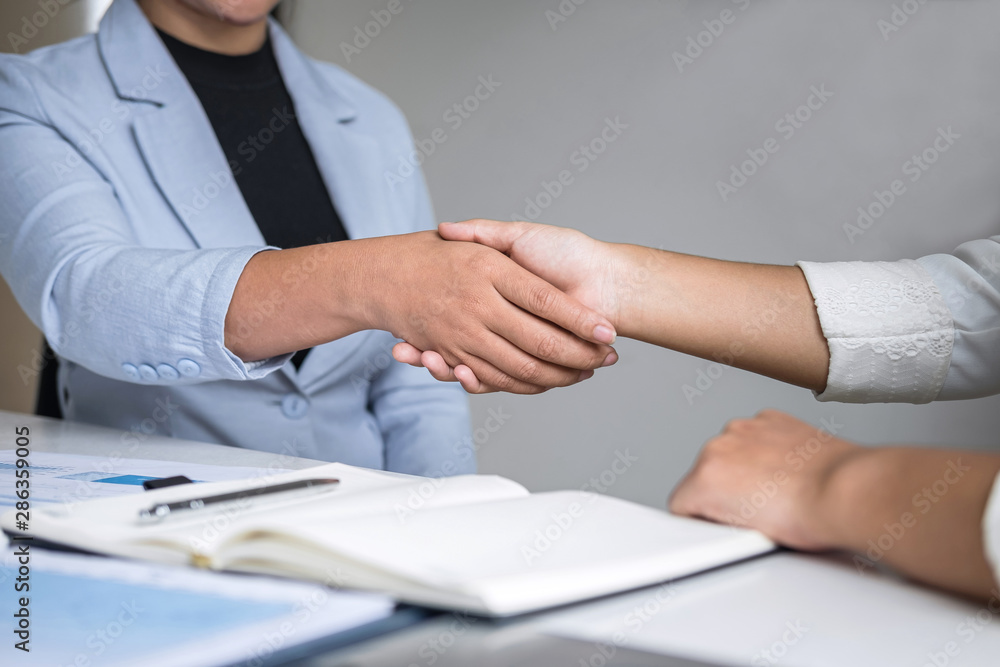 Obraz premium Finishing up a conversation after collaboration, handshake of two business woman leader after successful contract agreement to become a partner, collaborative negotiation partnership