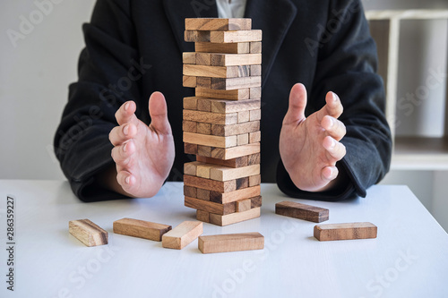 Quadro em tela Alternative Risk and Strategy in business, Business woman's hands protect balanc