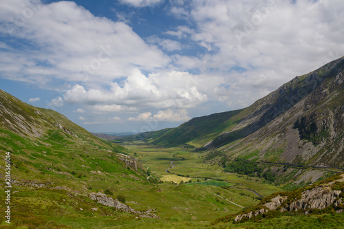 View across fields and valley. Snowdonia is a mountain range and a region in North of Wales.