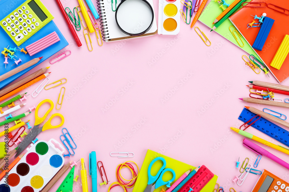 Different school supplies on pink background Different school supplies on pink background