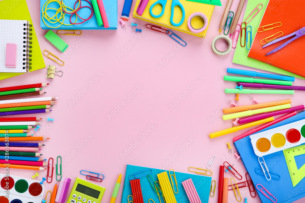 Different school supplies on pink background Different school supplies on pink background