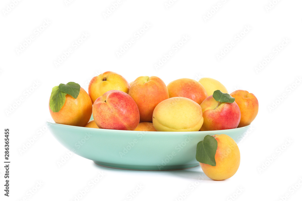 Sweet apricots in bowl isolated on white background Sweet apricots in bowl isolated on white background
