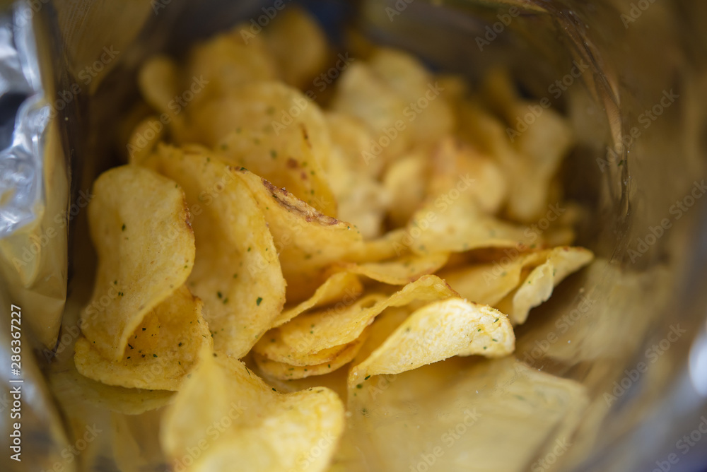 open pack of potato chips open pack of potato chips