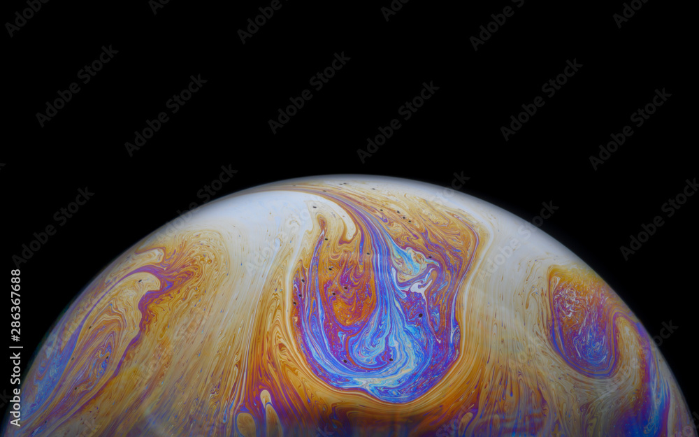 Abstract Soap bubble macro photo with black background look like planet Abstract Soap bubble macro photo with black background look like planet