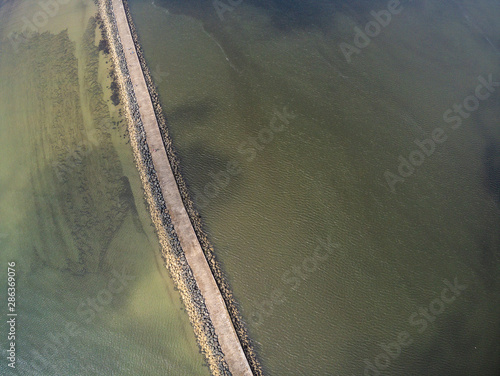 Photography Aerial view of walking path to Pollbeg Lighthouse in Dublin port