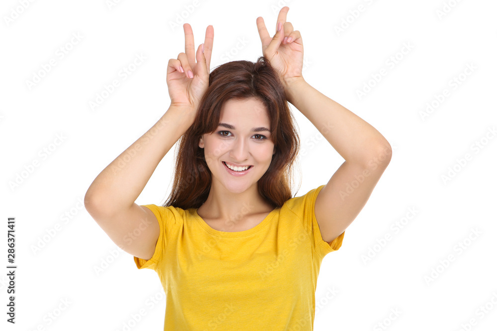Young woman in yellow t-shirt on white background Young woman in yellow t-shirt on white background