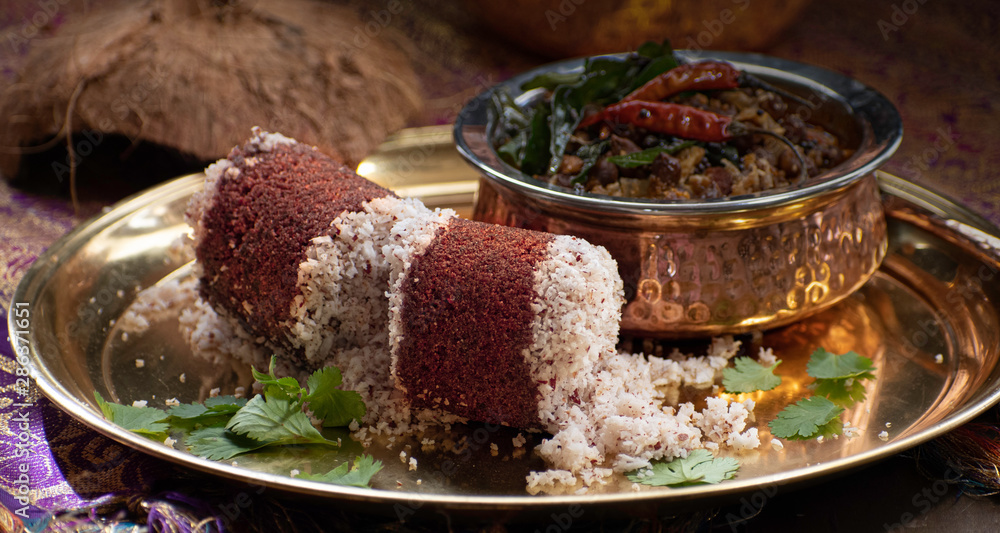 Millet Puttu- Indian Steamed Millet Flour Cakes, Layered with Coconut, Served with Chickpea Curry Millet Puttu- Indian Steamed Millet Flour Cakes, Layered with Coconut, Served with Chickpea Curry