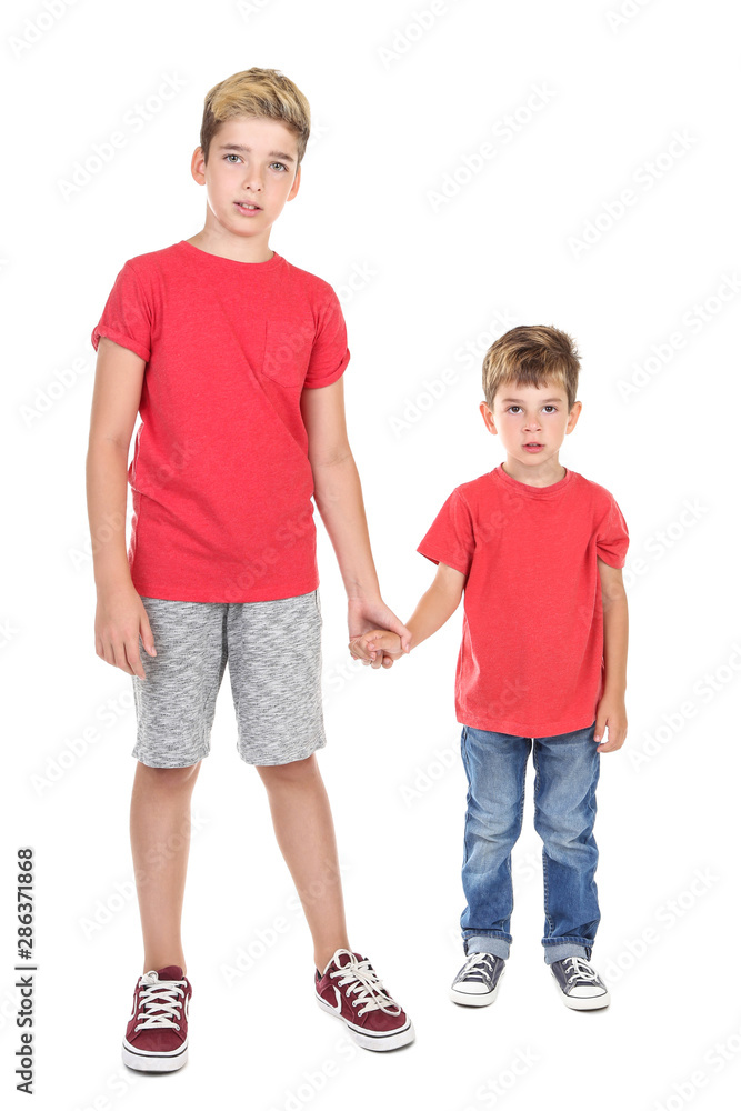 Two young brothers isolated on white background Two young brothers isolated on white background