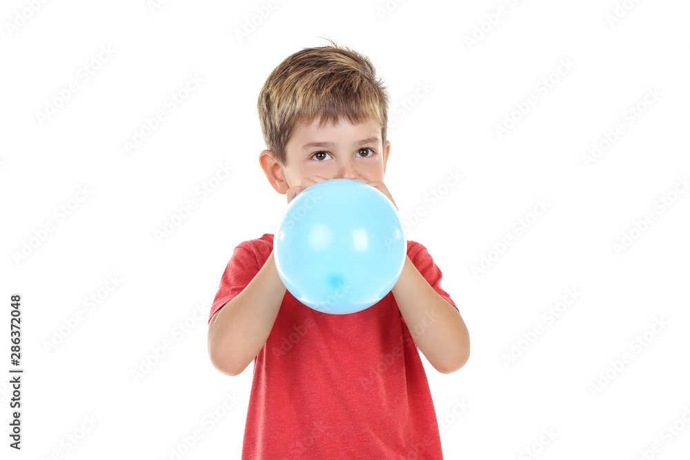 Little boy blowing blue balloon on white background Little boy blowing blue balloon on white background