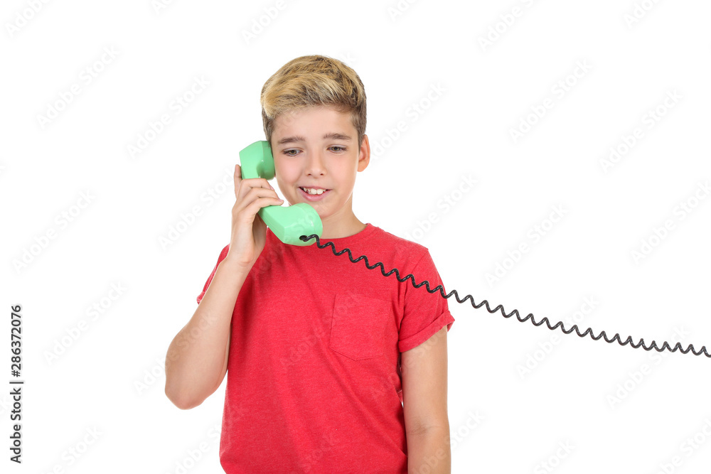 Young boy with handset on white background Young boy with handset on white background