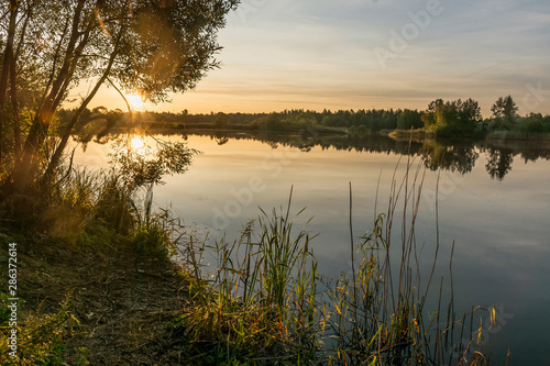 .Early morning on the shore of the quarry. Late summer, the last days of August.