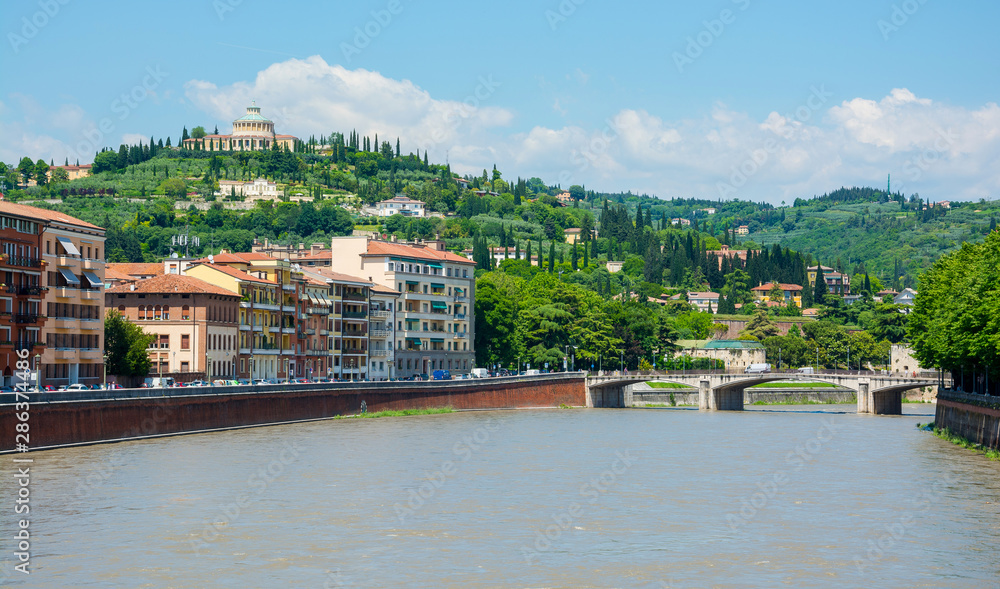 View of the Ponte Garibaldi and the Santuario della Madonna di Lourdes in Verona, Italy.