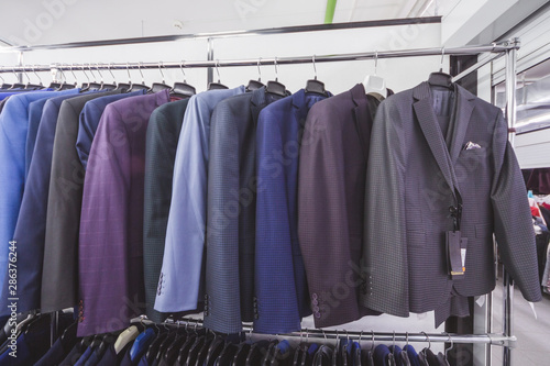 Pavilion with stylish classic men's jackets. Selection of strict classic clothing in the store.