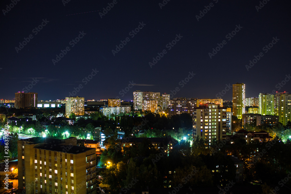 panorama of the night city with modern residential buildings in Moscow Russia